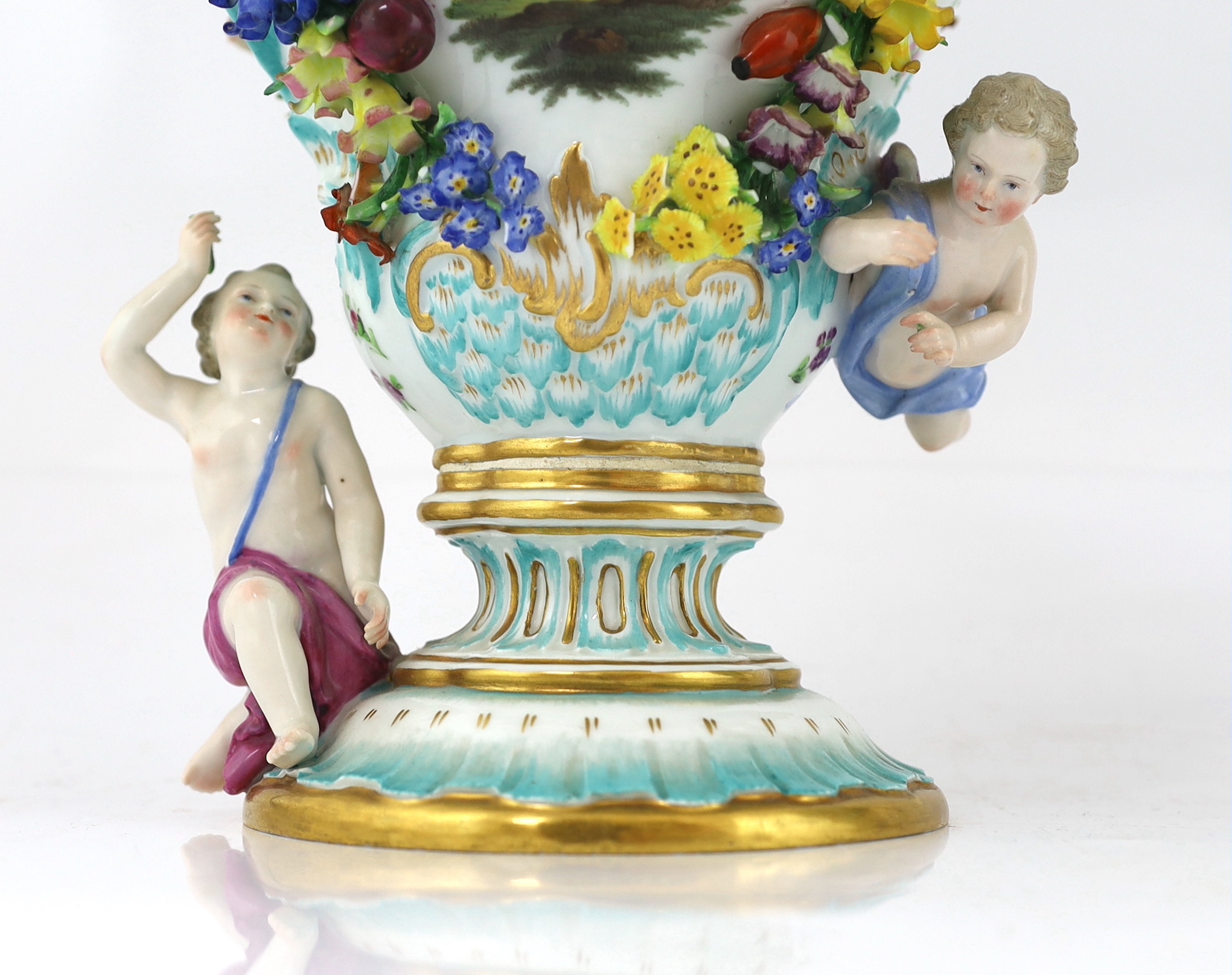 A pair of Meissen topographical flower encrusted vases and covers, 19th century, losses